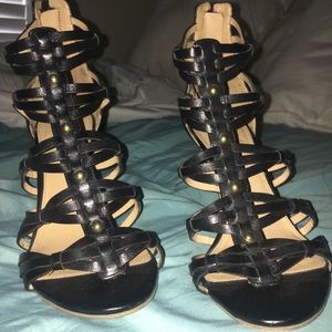 Strappy, black and gold Ivanka Trump heels